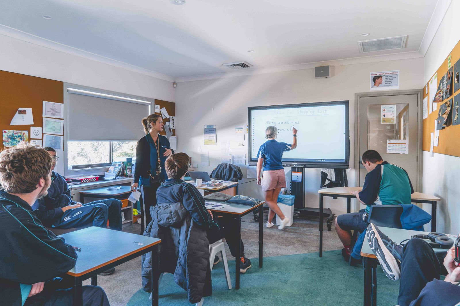 Classroom lesson with teacher and students engaged